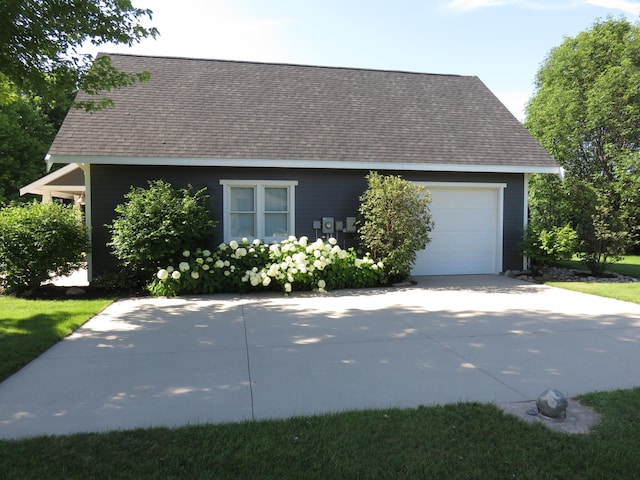 1504 4th St NE, Willmar, MN 56201 - view of side of property featuring roof with shingles, driveway, and an attached garage