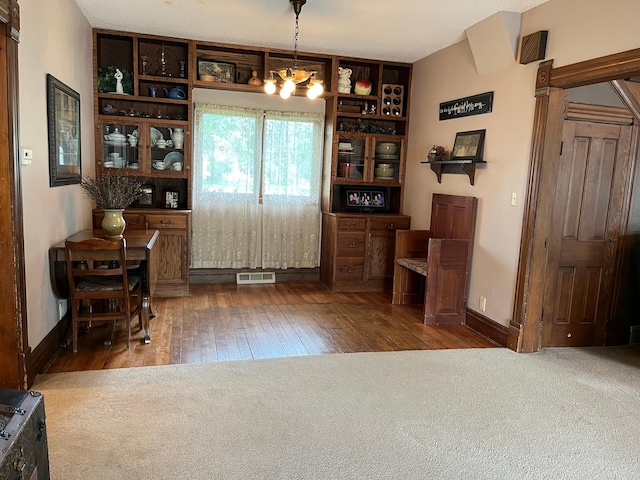 681 8th St, Walnut Grove, MN 56180 - dining area featuring hardwood / wood-style flooring and a chandelier