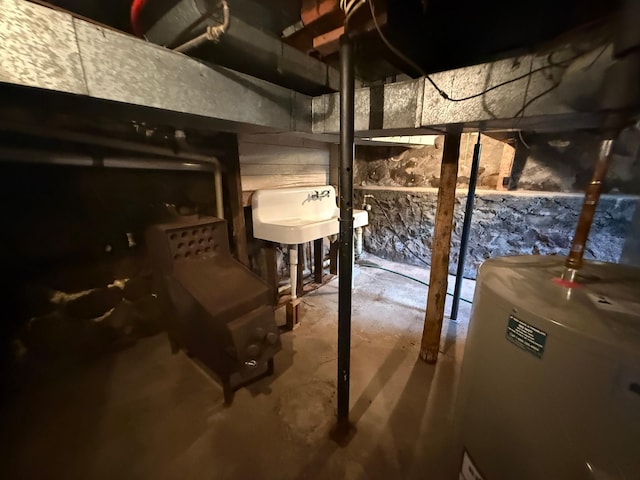 681 8th St, Walnut Grove, MN 56180 - unfinished basement featuring water heater and a sink
