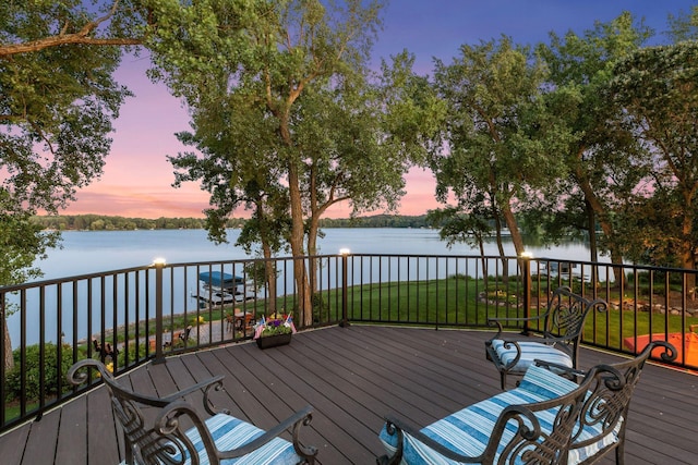 12795 Ozark Trl N, May Twp, MN 55082 - wooden deck featuring a water view and a lawn