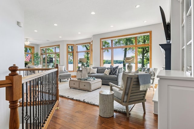 12795 Ozark Trl N, May Twp, MN 55082 - living area with hardwood / wood-style floors, recessed lighting, and ceiling fan