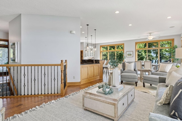 12795 Ozark Trl N, May Twp, MN 55082 - living room with recessed lighting, a ceiling fan, and light wood-style floors