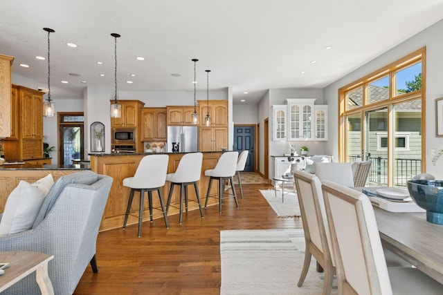 12795 Ozark Trl N, May Twp, MN 55082 - dining room with wood finished floors and recessed lighting