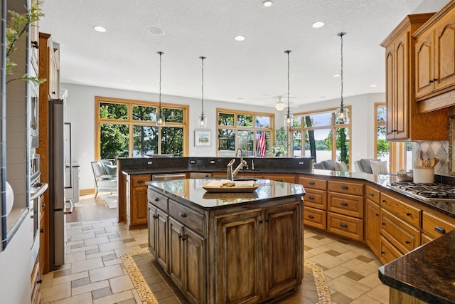 12795 Ozark Trl N, May Twp, MN 55082 - kitchen with a peninsula, recessed lighting, plenty of natural light, and a center island