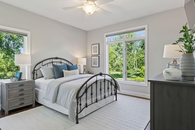 12795 Ozark Trl N, May Twp, MN 55082 - bedroom featuring wood finished floors and ceiling fan