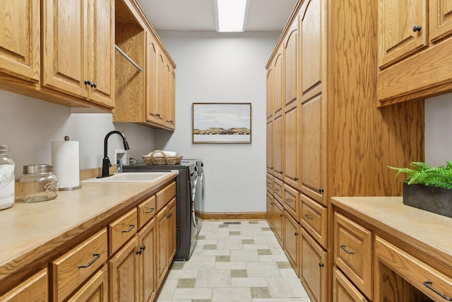 12795 Ozark Trl N, May Twp, MN 55082 - laundry room with washer and clothes dryer and cabinet space