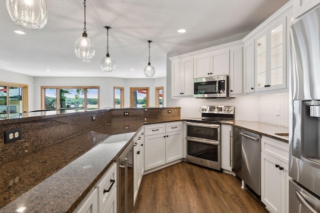 12795 Ozark Trl N, May Twp, MN 55082 - kitchen with stainless steel appliances, beverage cooler, dark wood-type flooring, recessed lighting, and white cabinets