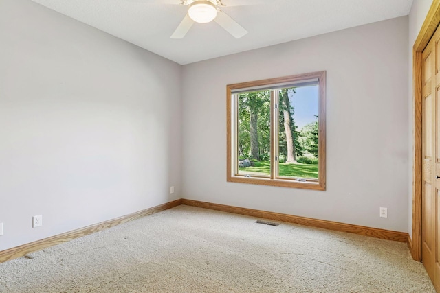 12795 Ozark Trl N, May Twp, MN 55082 - unfurnished room with carpet floors and a ceiling fan