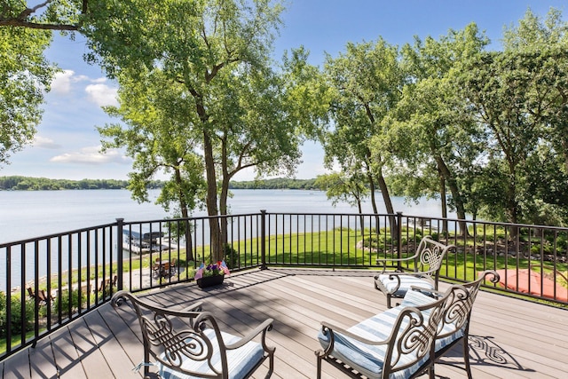 12795 Ozark Trl N, May Twp, MN 55082 - wooden deck with a water view