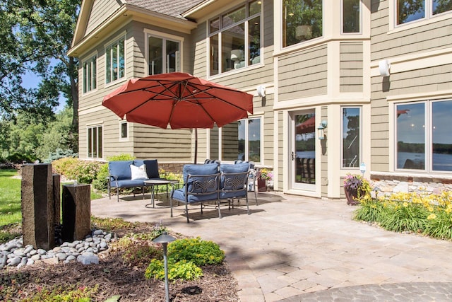 12795 Ozark Trl N, May Twp, MN 55082 - view of patio / terrace featuring an outdoor living space