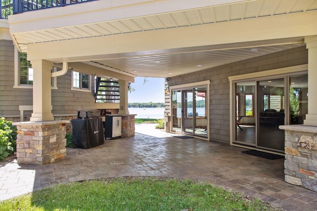 12795 Ozark Trl N, May Twp, MN 55082 - view of patio with a water view