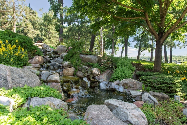 12795 Ozark Trl N, May Twp, MN 55082 - view of yard featuring a garden pond