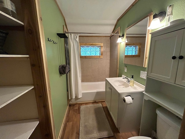 30290 7th Ave N, Swiss Twp, WI 54830 - full bathroom with vanity, wood finished floors, and shower / bath combo with shower curtain
