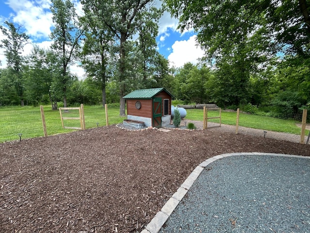 30290 7th Ave N, Swiss Twp, WI 54830 - view of grassy yard with an outdoor structure and view of wooded area