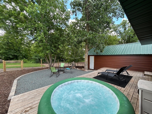 30290 7th Ave N, Swiss Twp, WI 54830 - view of pool featuring a jacuzzi, a wooden deck, and view of wooded area