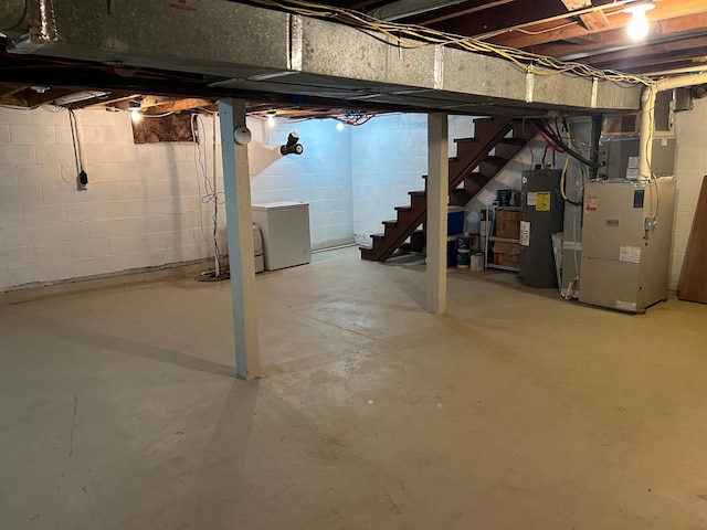 30290 7th Ave N, Swiss Twp, WI 54830 - unfinished basement with water heater, stairs, and heating unit