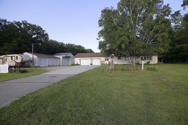 39070 County Highway 67, Newton Twp, MN 56567 - ranch-style house with a front lawn, stucco siding, and driveway