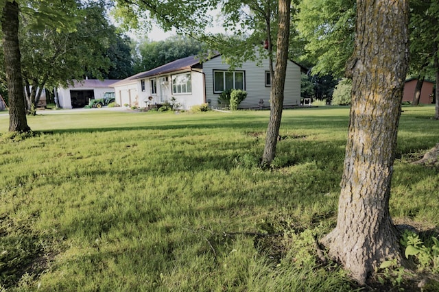39070 County Highway 67, Newton Twp, MN 56567 - view of green lawn featuring an attached garage