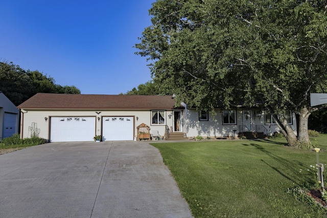 39070 County Highway 67, Newton Twp, MN 56567 - view of front of home with concrete driveway, a garage, and a front yard