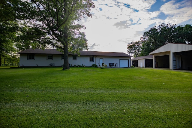 39070 County Highway 67, Newton Twp, MN 56567 - rear view of property with a detached garage and a yard