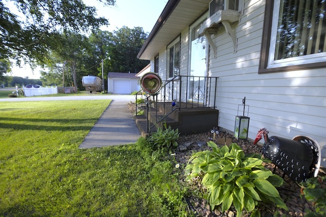 39070 County Highway 67, Newton Twp, MN 56567 - view of side of home featuring a lawn, an outbuilding, and a garage