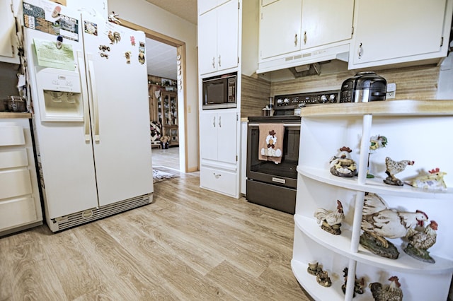 39070 County Highway 67, Newton Twp, MN 56567 - kitchen with white refrigerator with ice dispenser, stainless steel electric range oven, black microwave, under cabinet range hood, and light wood-type flooring