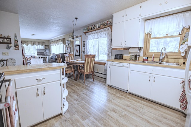 39070 County Highway 67, Newton Twp, MN 56567 - kitchen with dishwasher, a textured ceiling, light countertops, white cabinets, and light wood-type flooring