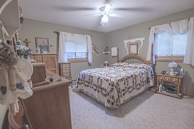 39070 County Highway 67, Newton Twp, MN 56567 - bedroom with light carpet, a textured ceiling, and ceiling fan