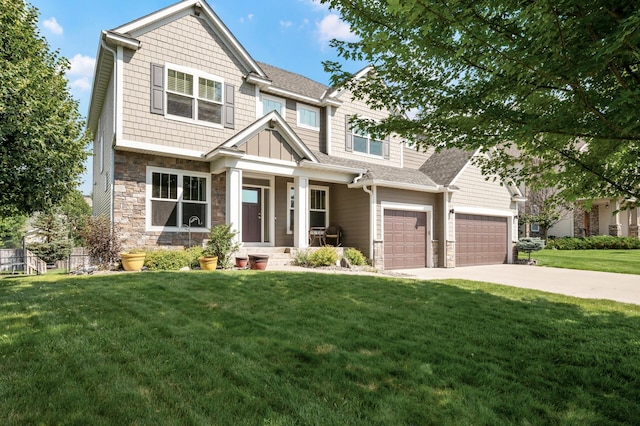 10412 Florida Ave N, Brooklyn Park, MN 55445 - craftsman inspired home with concrete driveway, a front lawn, stone siding, a garage, and covered porch