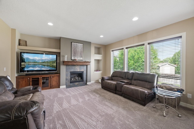 10412 Florida Ave N, Brooklyn Park, MN 55445 - living room with carpet, a tile fireplace, built in features, and recessed lighting