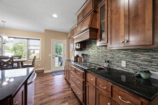10412 Florida Ave N, Brooklyn Park, MN 55445 - kitchen with appliances with stainless steel finishes, a chandelier, dark wood-style flooring, decorative backsplash, and hanging light fixtures