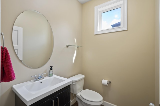 10412 Florida Ave N, Brooklyn Park, MN 55445 - half bathroom featuring vanity and toilet