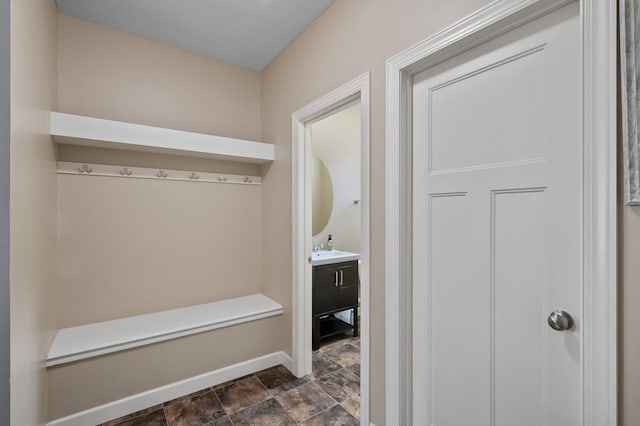 10412 Florida Ave N, Brooklyn Park, MN 55445 - mudroom with baseboards and stone finish flooring