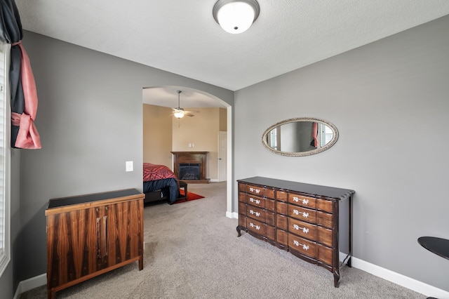 10412 Florida Ave N, Brooklyn Park, MN 55445 - carpeted bedroom with arched walkways and a fireplace