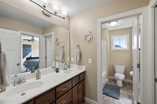 10412 Florida Ave N, Brooklyn Park, MN 55445 - ensuite bathroom with double vanity, a textured ceiling, tub / shower combination, a ceiling fan, and stone finish flooring