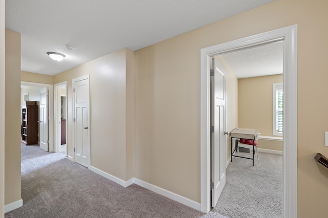 10412 Florida Ave N, Brooklyn Park, MN 55445 - corridor featuring carpet and baseboards