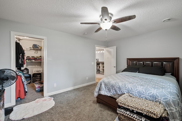 10412 Florida Ave N, Brooklyn Park, MN 55445 - carpeted bedroom featuring a spacious closet, a textured ceiling, and ceiling fan