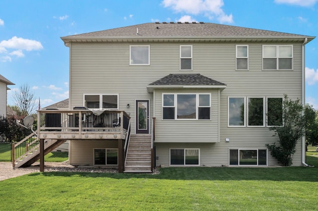 10412 Florida Ave N, Brooklyn Park, MN 55445 - rear view of house featuring stairway, a lawn, a deck, and roof with shingles