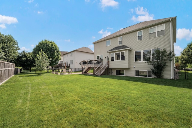10412 Florida Ave N, Brooklyn Park, MN 55445 - back of house with stairs, a fenced backyard, and a wooden deck