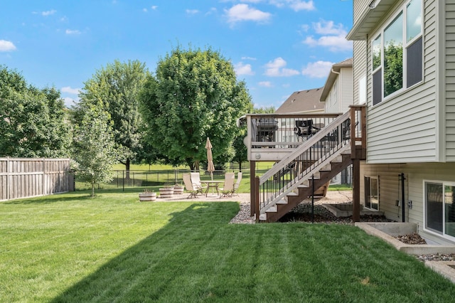 10412 Florida Ave N, Brooklyn Park, MN 55445 - fenced backyard with stairway, a deck, and a patio