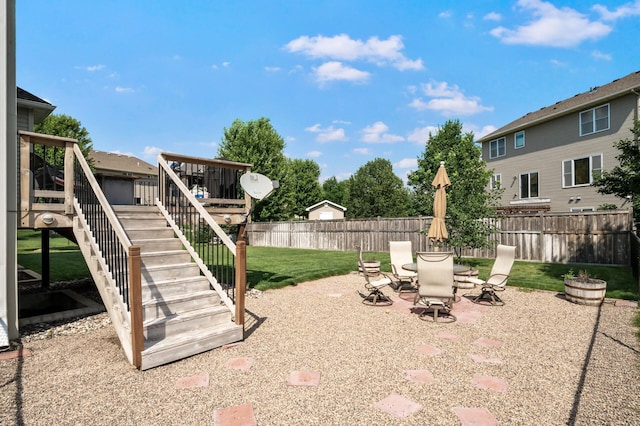 10412 Florida Ave N, Brooklyn Park, MN 55445 - fenced backyard with stairs, a wooden deck, and a patio