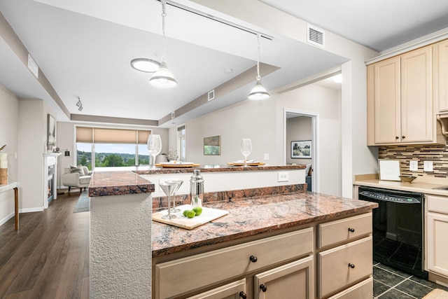 1126 Mesaba Ave Unit 118, Duluth, MN 55811 - kitchen featuring dishwasher, decorative backsplash, open floor plan, a tray ceiling, and pendant lighting