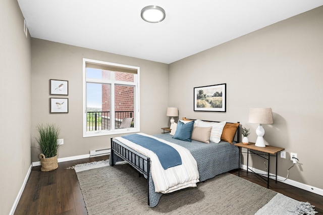1126 Mesaba Ave Unit 118, Duluth, MN 55811 - bedroom with baseboard heating and wood finished floors