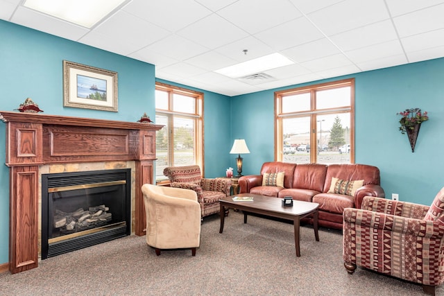 1126 Mesaba Ave Unit 118, Duluth, MN 55811 - living room featuring a paneled ceiling, a glass covered fireplace, and carpet floors