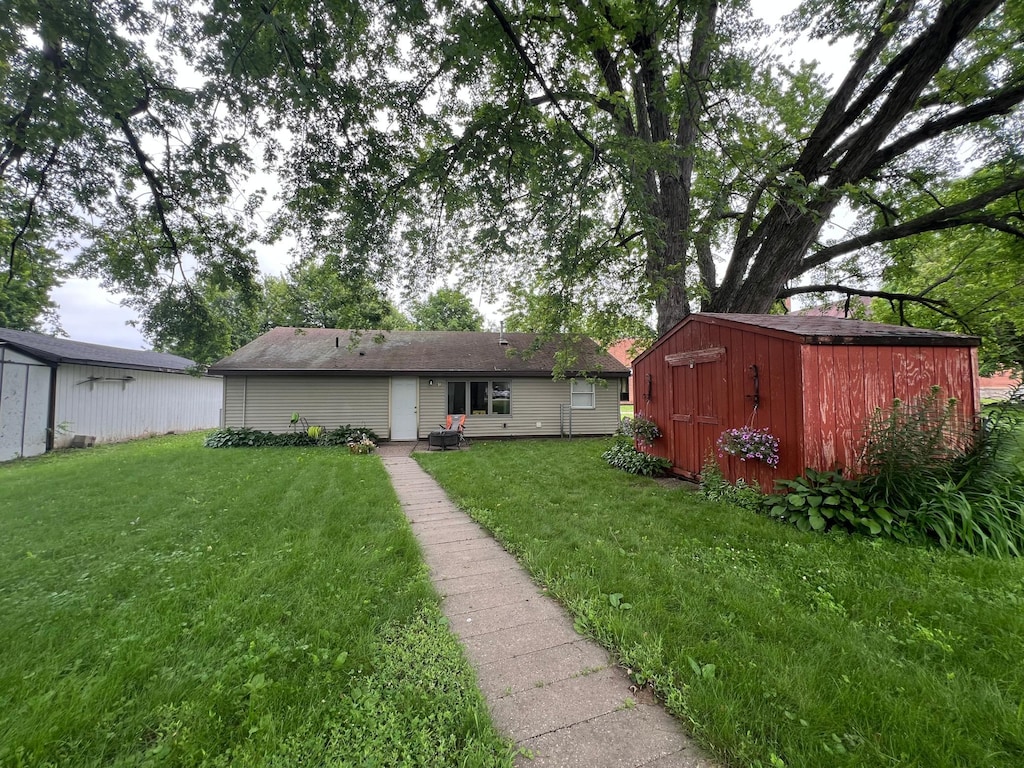 416 Wallace St N, Delano, MN 55328 - back of property featuring a shed and a yard