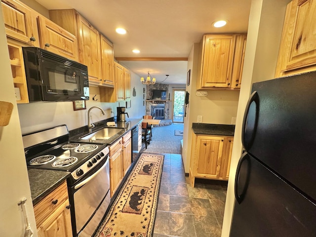 140 Bridge Run Ln Unit C, Lutsen Twp, MN 55615 - kitchen featuring black appliances, recessed lighting, dark stone finish floors, a chandelier, and dark stone countertops
