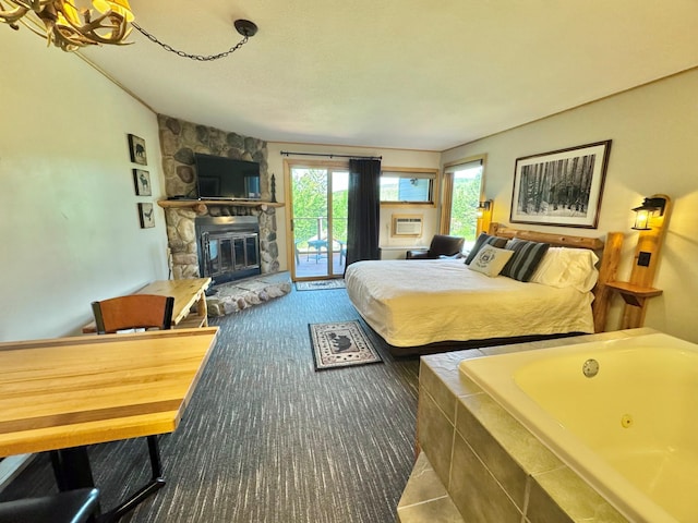 140 Bridge Run Ln Unit C, Lutsen Twp, MN 55615 - bedroom with access to outside and a fireplace