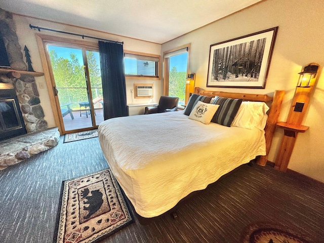 140 Bridge Run Ln Unit C, Lutsen Twp, MN 55615 - carpeted bedroom with access to outside, a stone fireplace, and cooling unit