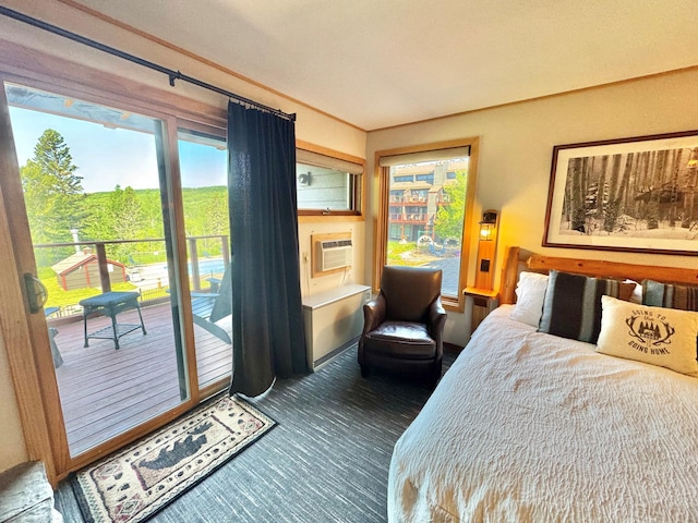140 Bridge Run Ln Unit C, Lutsen Twp, MN 55615 - bedroom featuring access to outside, dark colored carpet, and a wall mounted AC