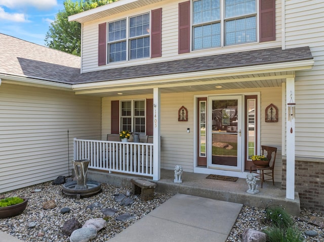 1405 17th Dr SW, Austin, MN 55912 - doorway to property with a porch and a shingled roof